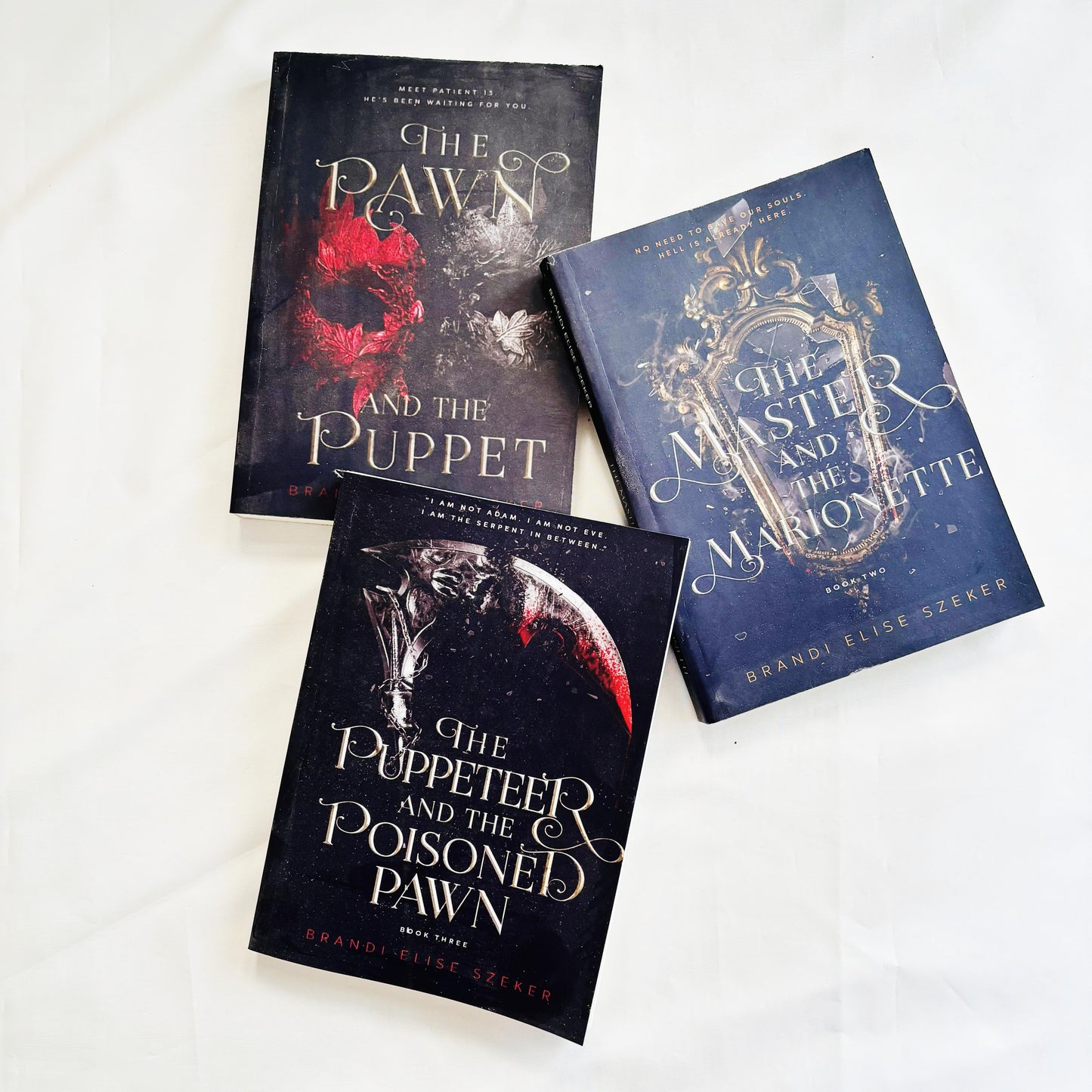 The Pawn and The Puppet series (The Pawn and The Puppet ,The Master and the Marionette ,The Puppeteer and The Poisoned Pawn ) by Brandi Elise Szeker